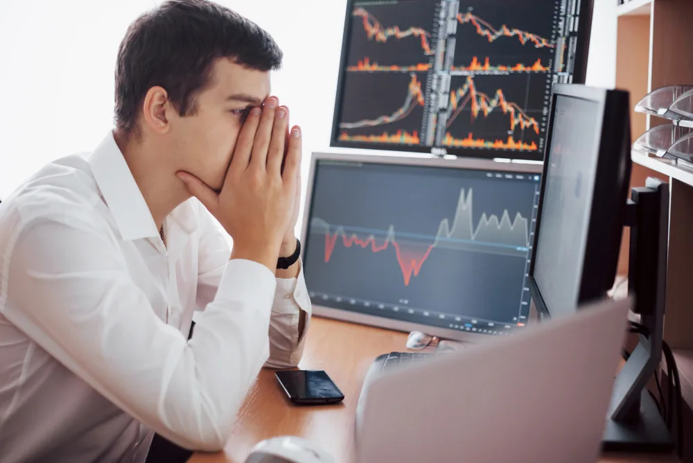 A trader is trying to control his emotions when trading